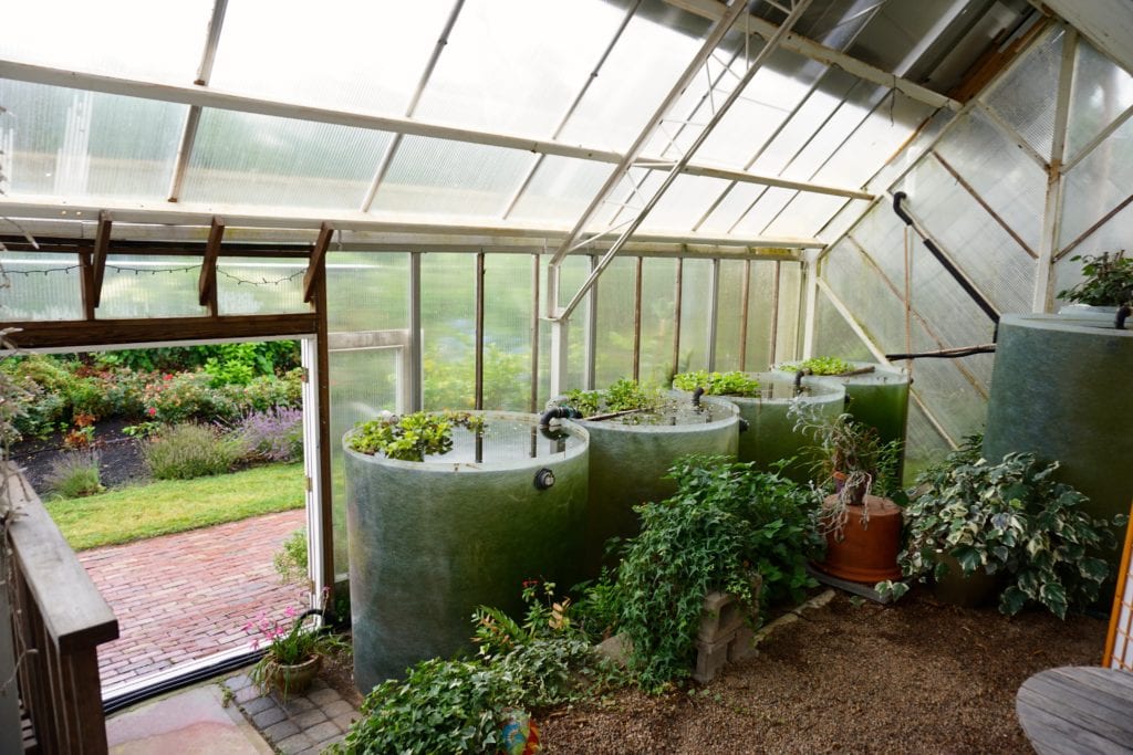how many water barrels to heat greenhouse