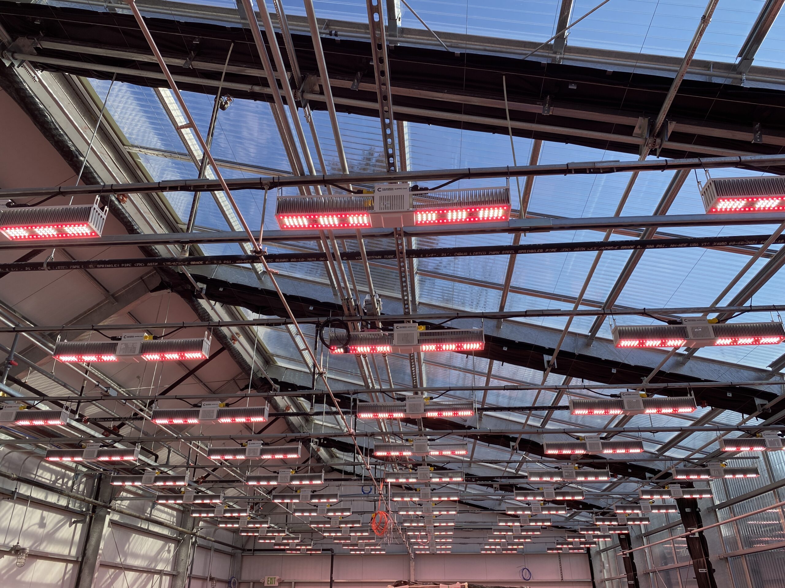 Integrated sensor and control systems mounted on greenhouse structural rails